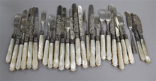 A set of twelve pairs of Victorian mother of pearl handled silver dessert eaters, Aaron Hadfield, Sheffield, 1844 & 3 butter knives.